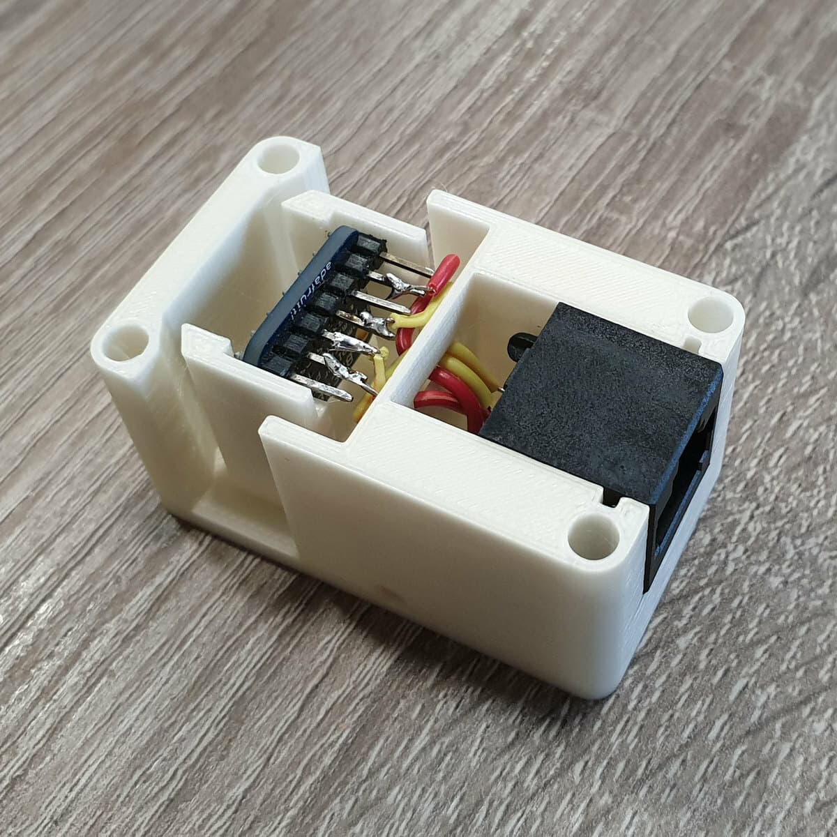 Nyomtatott tartókeret elektronikai modulhoz